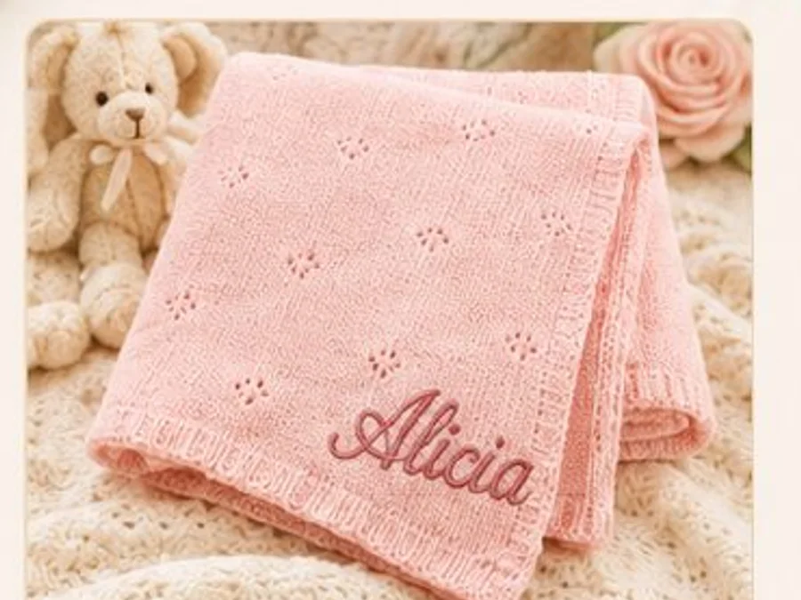 Pink personalized knit baby blanket with embroidered name