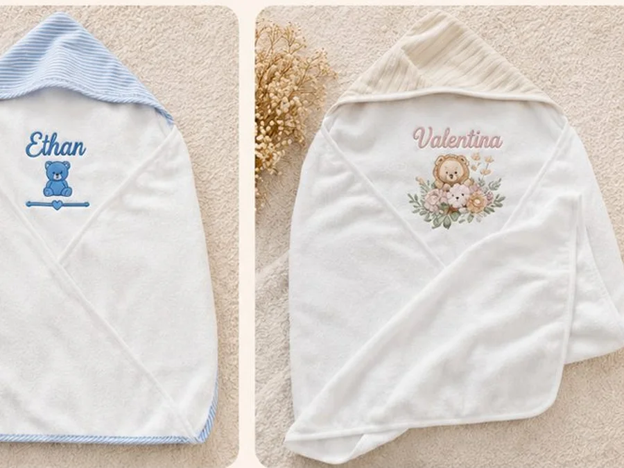 Two personalized hooded baby towels in blue and cream
